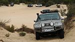 11-Whitey pushes his 100 Series up the dune at Ross Springs